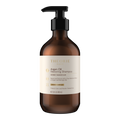 Brown shampoo bottle with black pump and white label on a white background